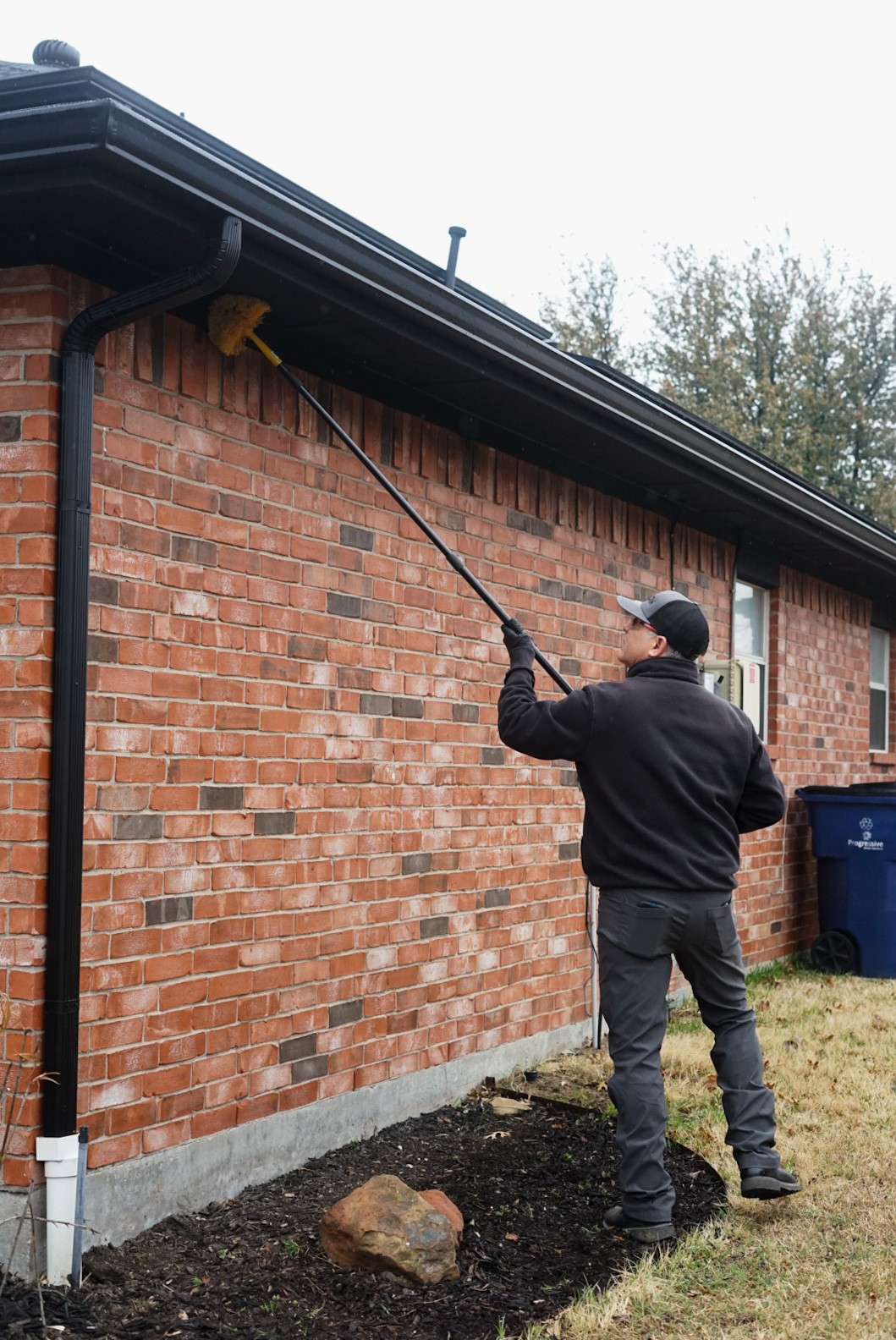 pest control technician treating an exterior